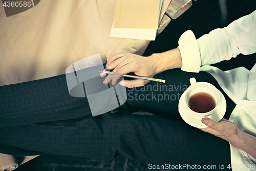 Image of Architect working on drawing table in office