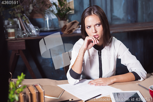 Image of Portrait of a businesswoman who is working at office