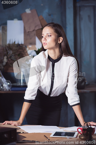 Image of Architect working on drawing table in office