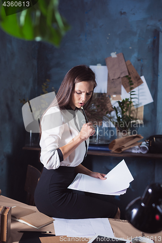 Image of Portrait of a businesswoman who is working at office