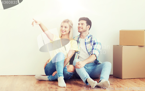 Image of couple with boxes moving to new home and dreaming