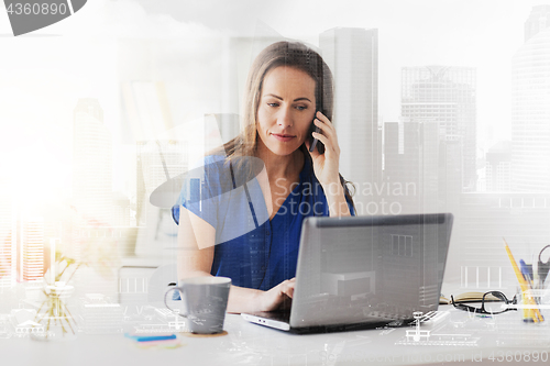 Image of woman calling on smartphone at office