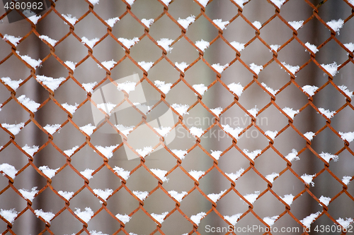 Image of old metal fence grid pattern