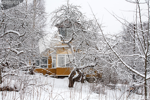 Image of old villa in winter orchard
