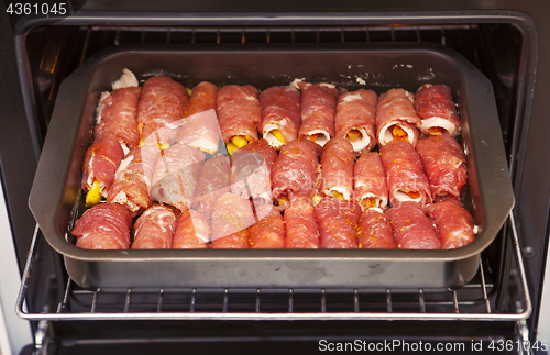 Image of meat rolls in oven