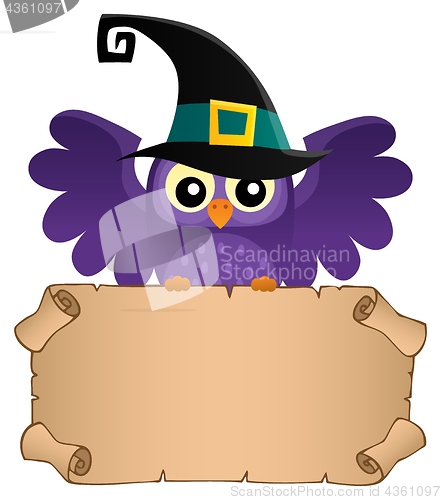 Image of Halloween owl holding small parchment