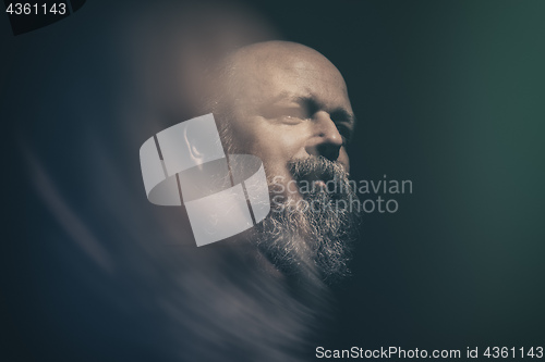 Image of bearded bald man