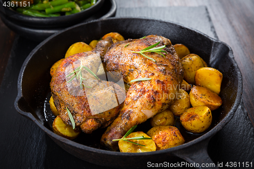 Image of Baked chicken legs with potatos