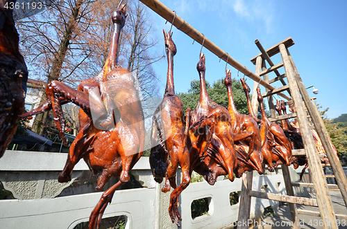 Image of Rows of cured meat hanging to dry