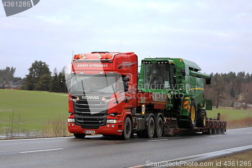 Image of Scania Truck Hauls Combine as Wide Load