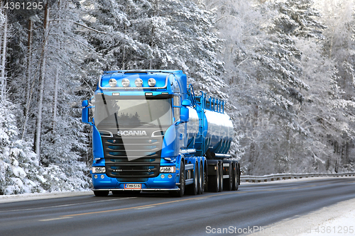 Image of Blue Scania Tank Truck Trucking Uphill in Winter