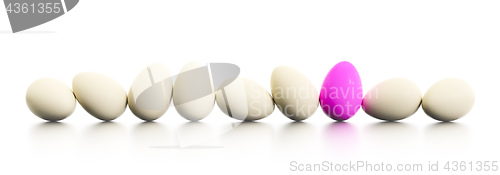 Image of a row of easter eggs one dyed in pink