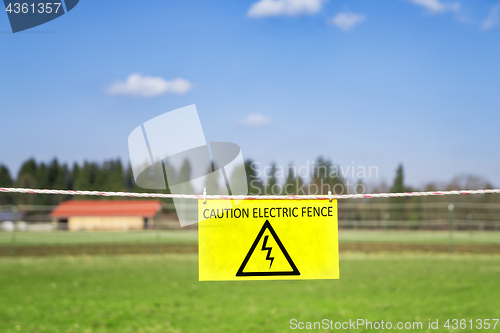 Image of electric fence at a green meadow