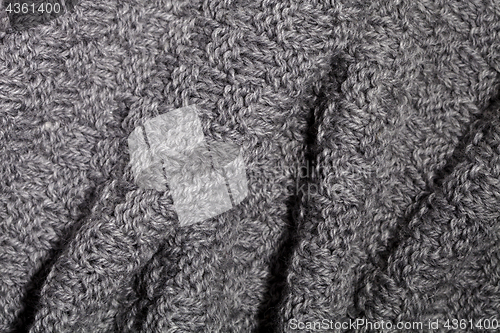 Image of knitted grey scarf