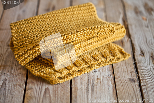 Image of knitted yellow scarf