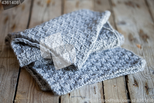 Image of knitted grey scarf