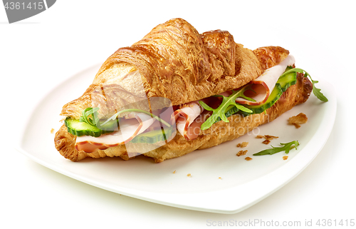 Image of croissant with ham and cucumber