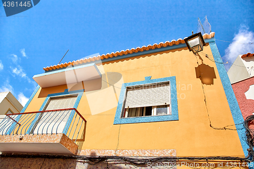 Image of Beautiful yellow house of Alvor, Portugal