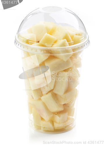 Image of fresh pineapple pieces salad in plastic cup