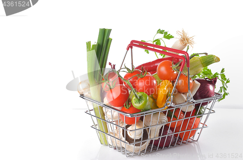 Image of Raw vegetables in basket isolated 