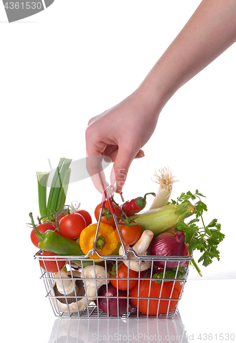 Image of Raw vegetables in basket isolated on white