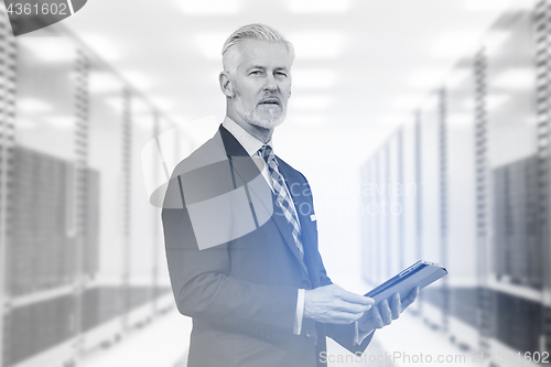 Image of Senior businessman in server room