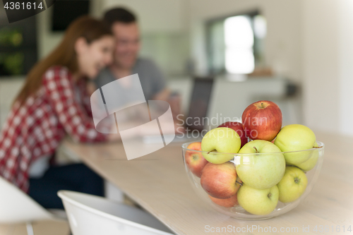 Image of happy young couple buying online