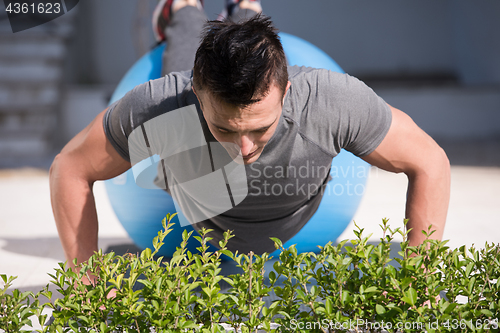 Image of man doing morning yoga exercises