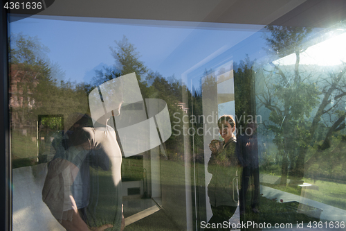 Image of couple enjoying on the door of their luxury home villa