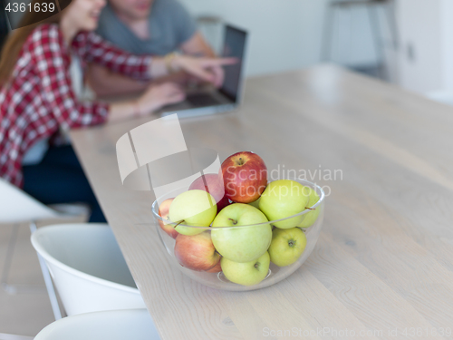 Image of happy young couple buying online
