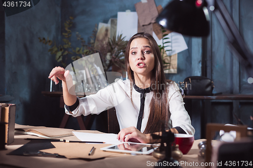 Image of Portrait of a businesswoman who is working at office