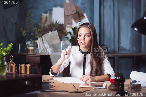 Image of Portrait of a businesswoman who is working at office