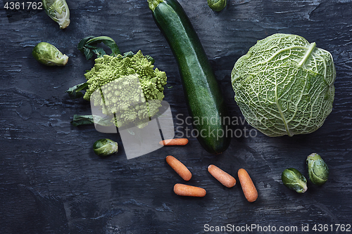 Image of Organic vegetables on wooden table. Top view