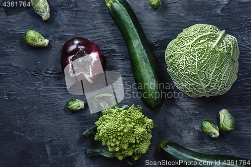 Image of Organic vegetables on wooden table. Top view