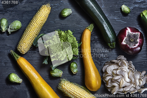 Image of Organic vegetables on wooden table. Top view