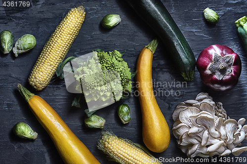 Image of Organic vegetables on wooden table. Top view