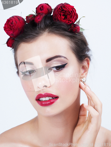 Image of young hispanic girl with flower red rose in hairs