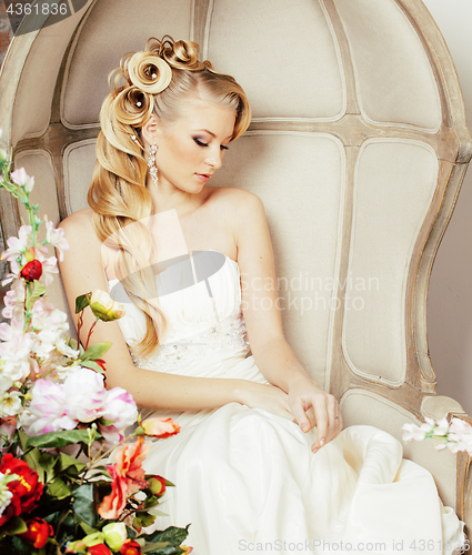 Image of beauty young bride alone in luxury vintage interior with a lot o