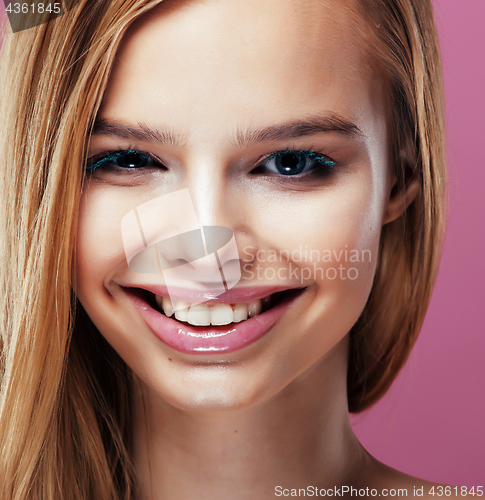 Image of young pretty blonde woman with hairstyle close up and makeup on 