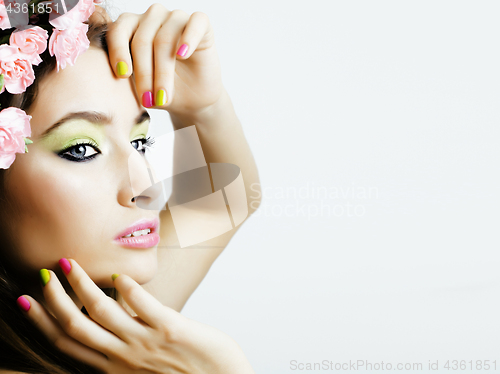 Image of Beauty young woman with flowers and make up close up, real spring beauty girl floral pink manicure
