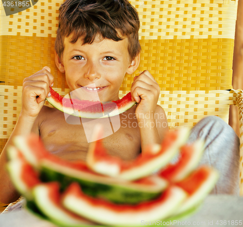 Image of cute young little boy with watermelon crustes smiling