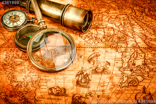 Image of Vintage still life. Vintage items on ancient map.