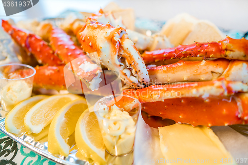 Image of Red king crab legs with fresh lemon slices