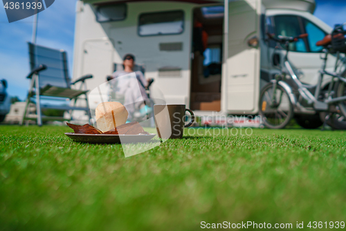 Image of Coffee Mug on grass. Family vacation travel, holiday trip in mot