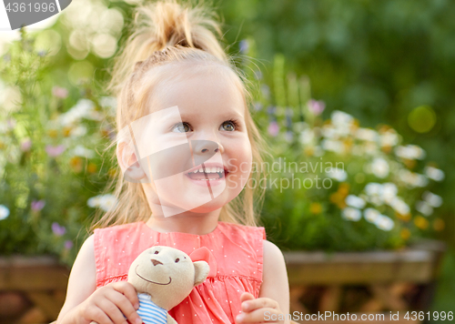 Image of portrait of happy beautiful little girl outdoors