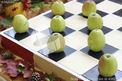 Image of Apples on chessboard