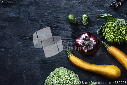 Image of Organic vegetables on wooden table. Top view