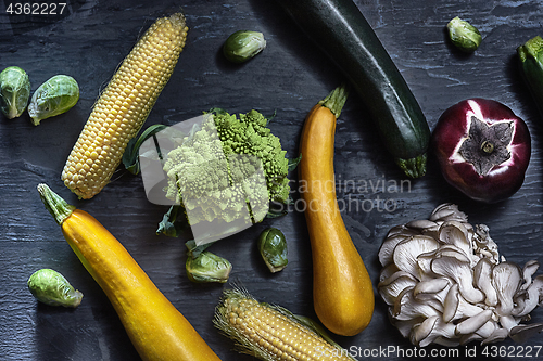 Image of Organic vegetables on wooden table. Top view