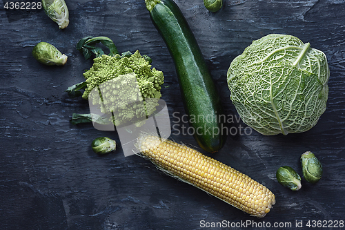 Image of Organic vegetables on wooden table. Top view