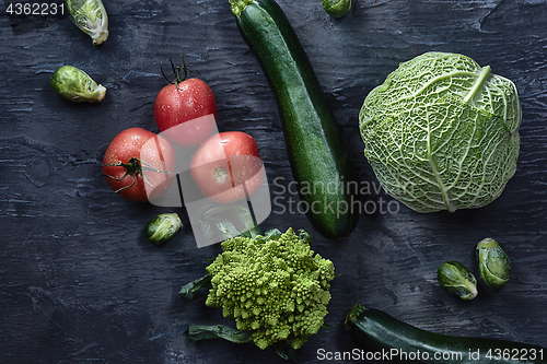 Image of Organic vegetables on wooden table. Top view